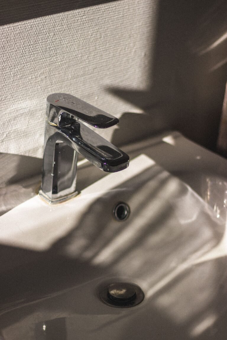 Chrome faucet installed on a bathroom sink, Aurora, CO
